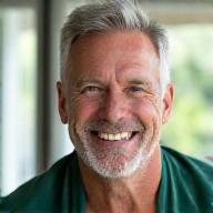 Portrait of David Chen, a fit, smiling man in his late 40s or early 50s, exuding vitality, symbolizing improved fitness and weight loss.